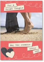 Couple's feet in beach sand