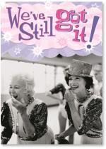 Two women dressed in glittery costumes