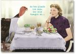 A turkey and a woman sitting at a table.