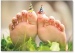 Toes with birthday hats.