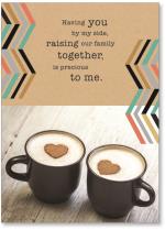 Two cups of latte with brown hearts