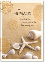 Starfish and shells on sand