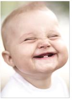Baby with toothy smile