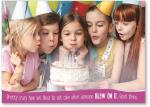 Girl blowing out candles