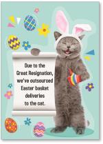 Cat wearing bunny ears and holding sign