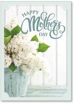 White lilacs in rustic blue bucket