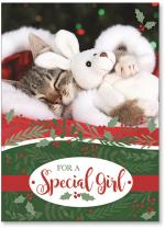 Sleeping cat in Santa outfit