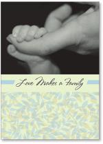 A baby holding a finger