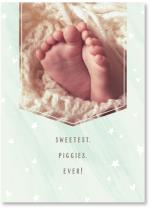 Baby feet in white blanket