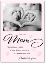 hands forming heart around child's hands