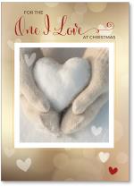 Hands holding snow heart